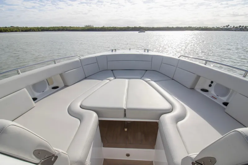  Yacht Photos Pics Luxurious seating area on 2025 MJM 38 X boat, overlooking serene waters.