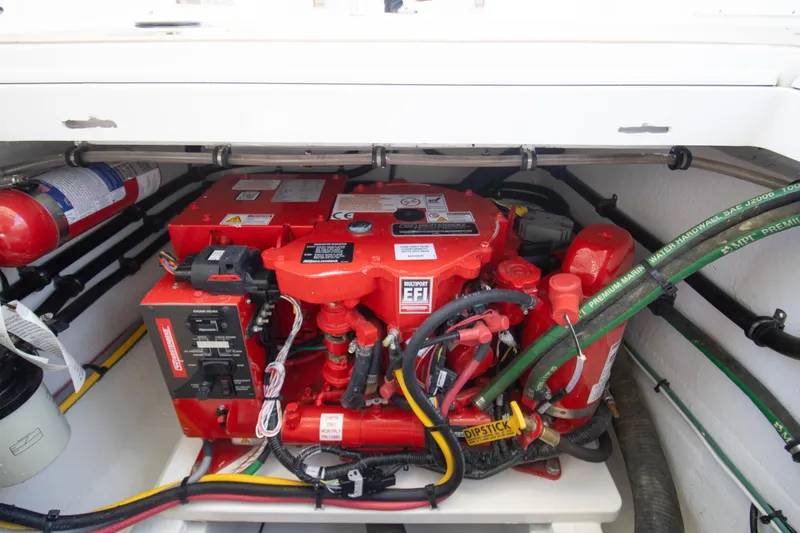  Yacht Photos Pics Engine compartment of 2025 MJM 38 X boat, featuring red EFI engine and fire extinguisher.