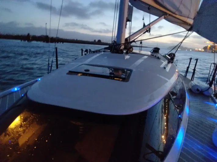  Yacht Photos Pics Sailing on a 2025 Faro Yachts 29 at dusk, illuminated by blue deck lights.