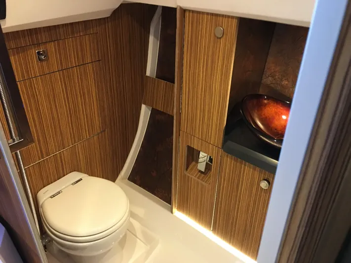  Yacht Photos Pics Luxurious bathroom interior of 2025 Faro Yachts 29, featuring wood paneling and modern fixtures.