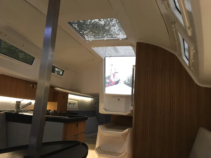  Yacht Photos Pics Interior of 2025 Faro Yachts 29, featuring modern design and wood accents.