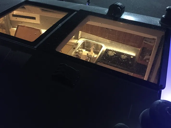  Yacht Photos Pics Interior view of 2025 Faro Yachts 29 through skylight, showcasing kitchen area.