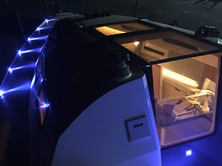  Yacht Photos Pics 2025 Faro Yachts 29 with illuminated deck and modern interior at night.