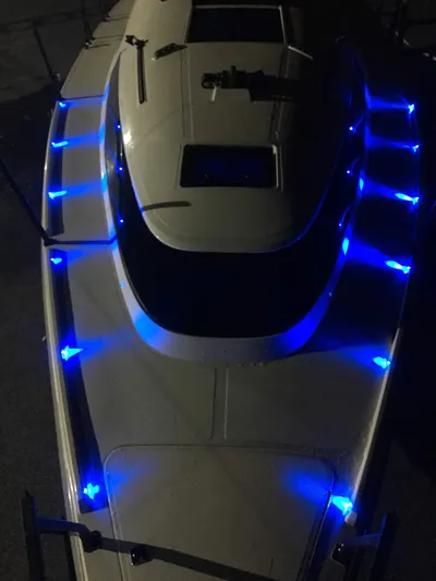  Yacht Photos Pics Faro Yachts 29, 2025 model, illuminated with blue LED lights at night.