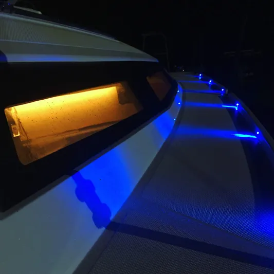  Yacht Photos Pics 2025 Faro Yachts 29 with illuminated blue and amber lights at night.