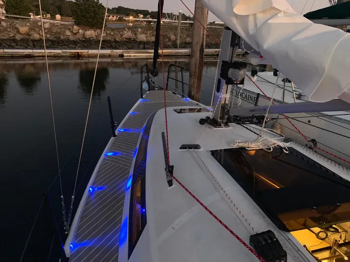  Yacht Photos Pics 2025 Faro Yachts 29 sailboat with blue deck lights docked at sunset.