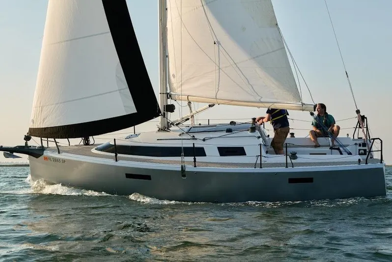  Yacht Photos Pics 2025 Faro Yachts 29 sailing on open water with two people onboard.