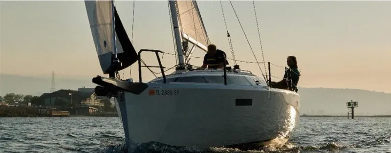  Yacht Photos Pics 2025 Faro Yachts 29 sailing on calm waters at sunset.