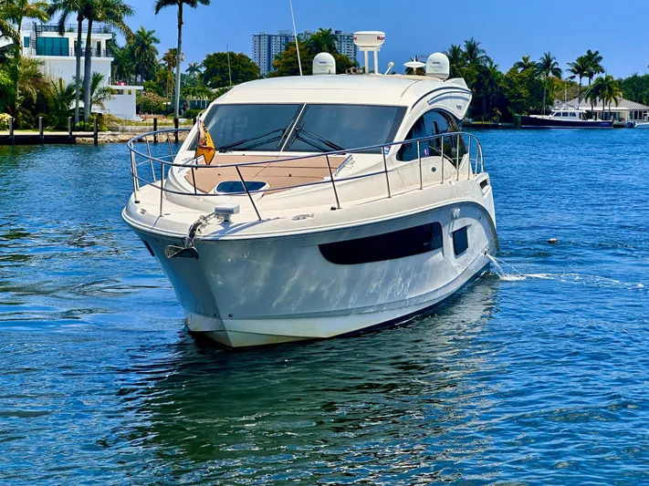  Yacht Photos Pics 2016 Sea Ray 400 Sundancer yacht cruising on a sunny day in a tropical setting.