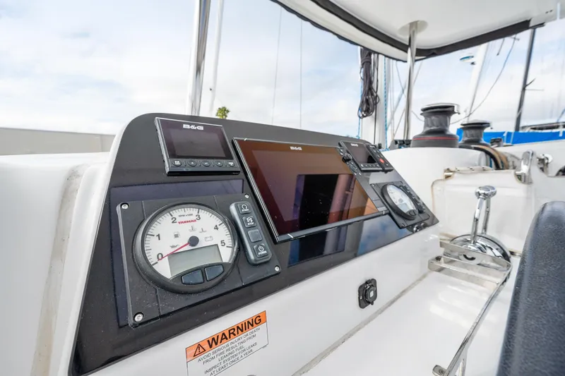 Aquaholic Yacht Photos Pics Control panel of a 2018 Lagoon 42 catamaran with navigation instruments.