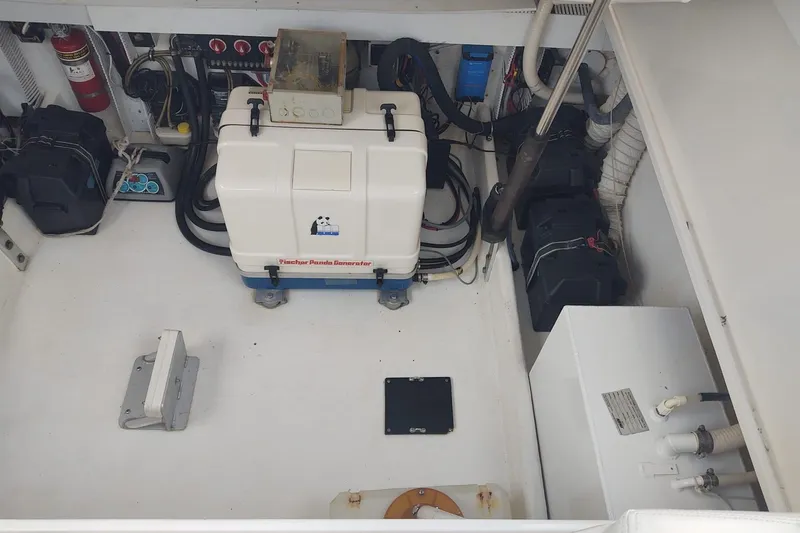 El Falcon Yacht Photos Pics Engine room of 2008 Contender 35 Express Side Console with Fischer Panda generator.