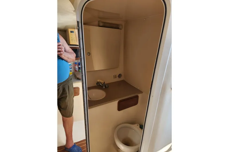 El Falcon Yacht Photos Pics 2008 Contender 35 Express Side Console boat bathroom interior with sink and toilet.