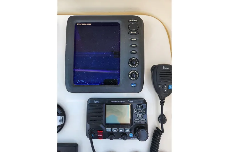 El Falcon Yacht Photos Pics Console electronics on a 2008 Contender 35 Express Side Console boat, featuring Furuno and Icom devices.