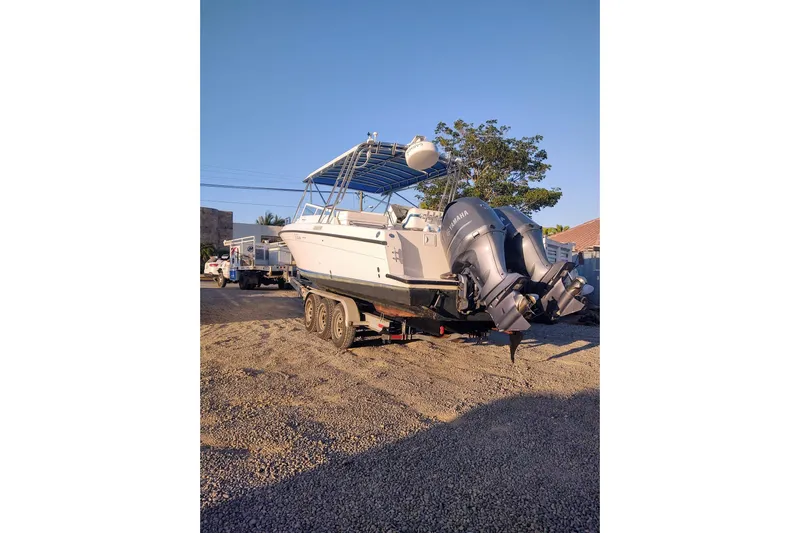 El Falcon Yacht Photos Pics 2008 Contender 35 Express Side Console boat on trailer with dual Yamaha outboard engines.