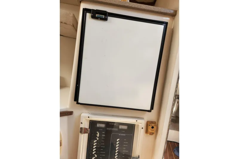 El Falcon Yacht Photos Pics 2008 Contender 35 Express Side Console interior with fridge and control panel.