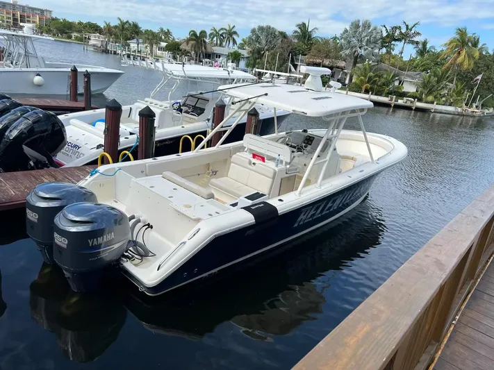 Relentless Yacht Photos Pics 2009 Pursuit S 310 Sport boat docked with twin Yamaha engines.