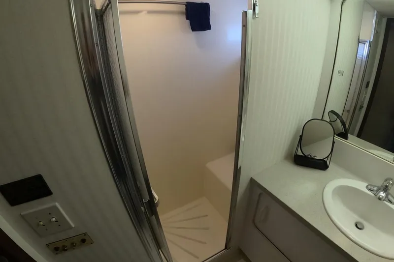 Saint Paul Yacht Photos Pics Bathroom interior of 1987 Hatteras 54 Motor Yacht with shower and sink.
