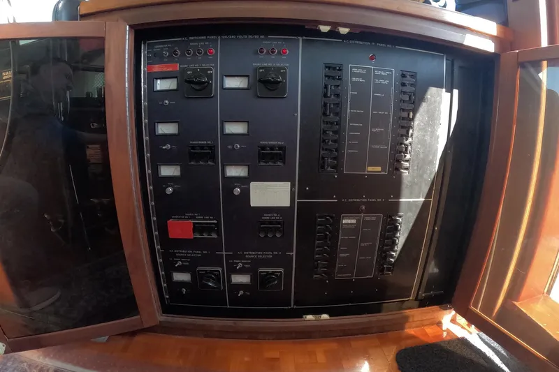 Saint Paul Yacht Photos Pics Electrical control panel on a 1987 Hatteras 54 Motor Yacht, featuring switches and gauges.