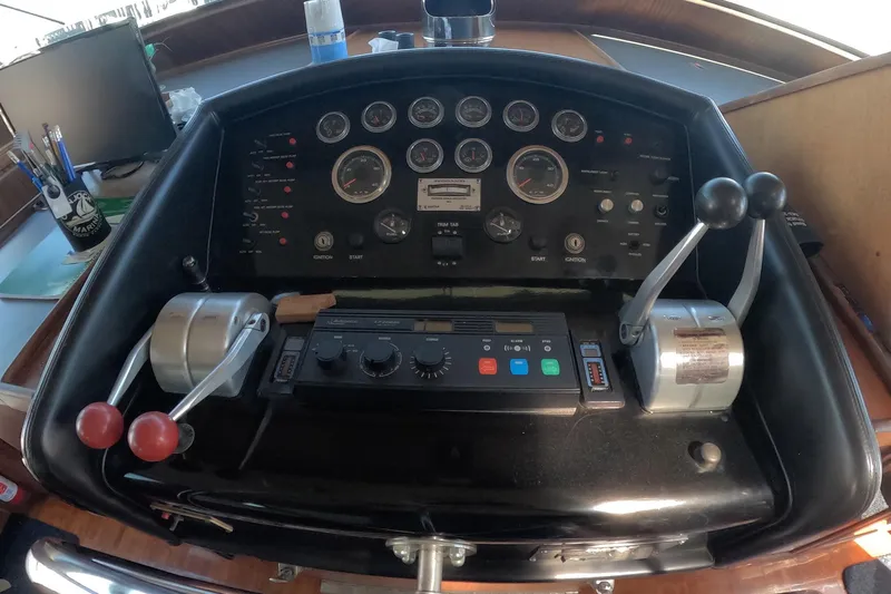 Saint Paul Yacht Photos Pics Control panel of a 1987 Hatteras 54 Motor Yacht with gauges and levers.