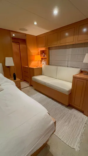 Mazag Yacht Photos Pics Interior of 2007 Arno Leopard 27 yacht with cozy seating and warm lighting.