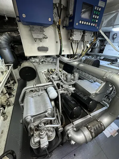 Mazag Yacht Photos Pics Engine room of a 2007 Arno Leopard 27 yacht, showcasing machinery and control panels.