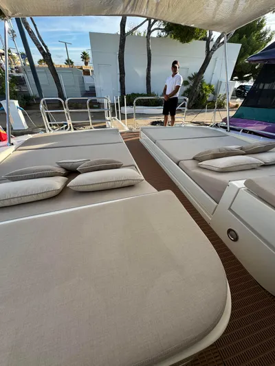 Mazag Yacht Photos Pics Luxury yacht deck with sunbeds, Arno Leopard 27, 2007 model, outdoor relaxation area.