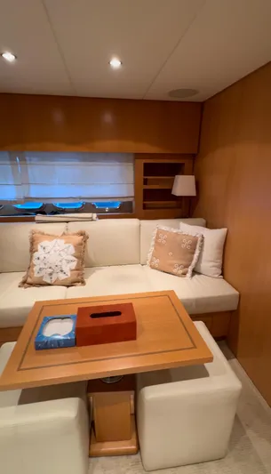 Mazag Yacht Photos Pics Luxurious interior of 2007 Arno Leopard 27 yacht with cozy seating and elegant decor.