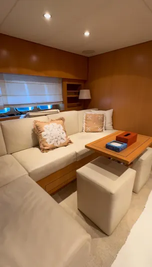 Mazag Yacht Photos Pics Luxurious interior of 2007 Arno Leopard 27 yacht with beige seating and wooden accents.