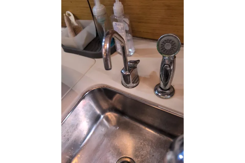  Yacht Photos Pics Stainless steel sink and faucet in Jeanneau Sun Odyssey 44i yacht kitchen, 2009 model.