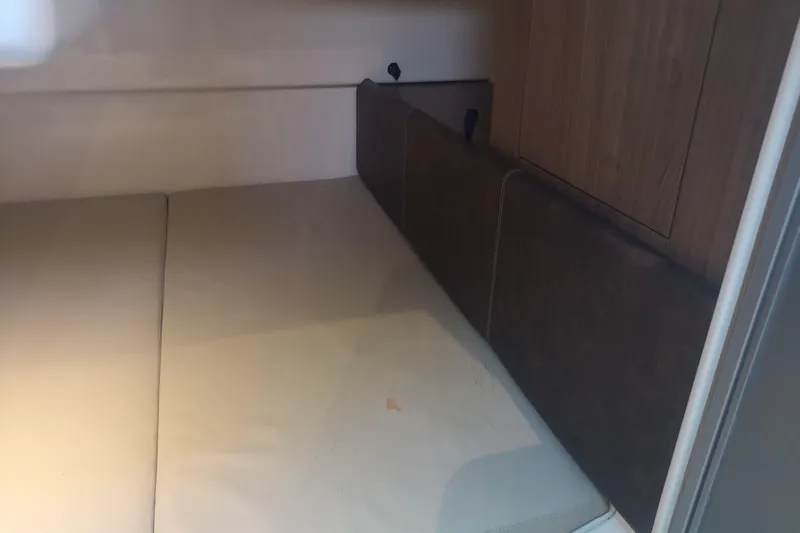  Yacht Photos Pics Interior cabin of 2016 Boston Whaler 315 Conquest Pilothouse, featuring cushioned seating.