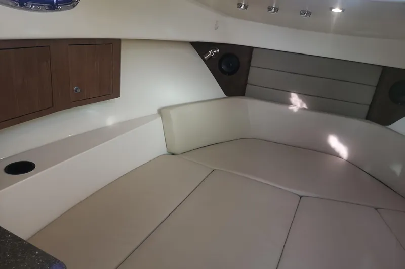  Yacht Photos Pics Interior cabin of 2016 Boston Whaler 315 Conquest Pilothouse with cushioned seating.