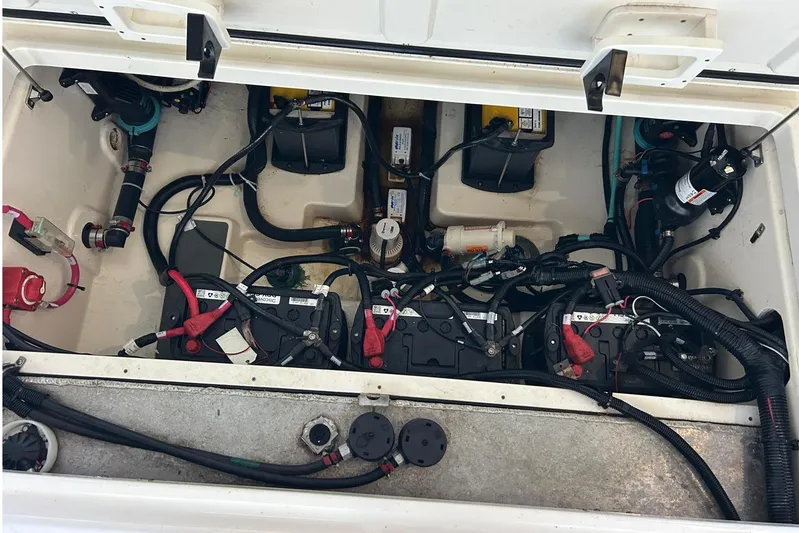  Yacht Photos Pics Engine compartment of a 2016 Boston Whaler 315 Conquest Pilothouse with visible batteries and wiring.