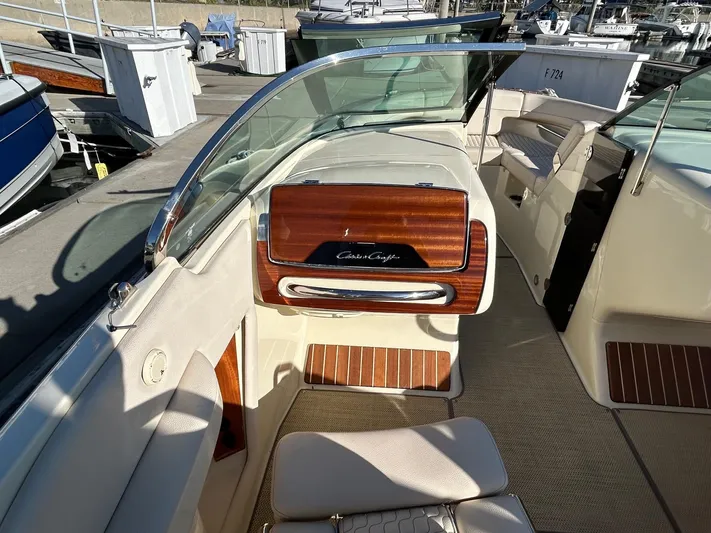  Yacht Photos Pics 2020 Chris-Craft 25 Launch GT boat interior with elegant wood accents and seating.