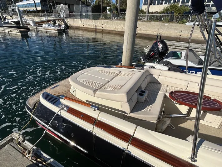  Yacht Photos Pics 2020 Chris-Craft 25 Launch GT boat docked in marina, featuring elegant seating and sleek design.