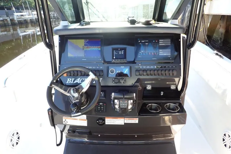  Yacht Photos Pics 2022 Blackfin 272 CC boat dashboard with advanced navigation and control systems.