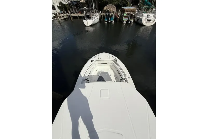  Yacht Photos Pics 2022 Blackfin 272 CC boat docked in a marina, viewed from above.