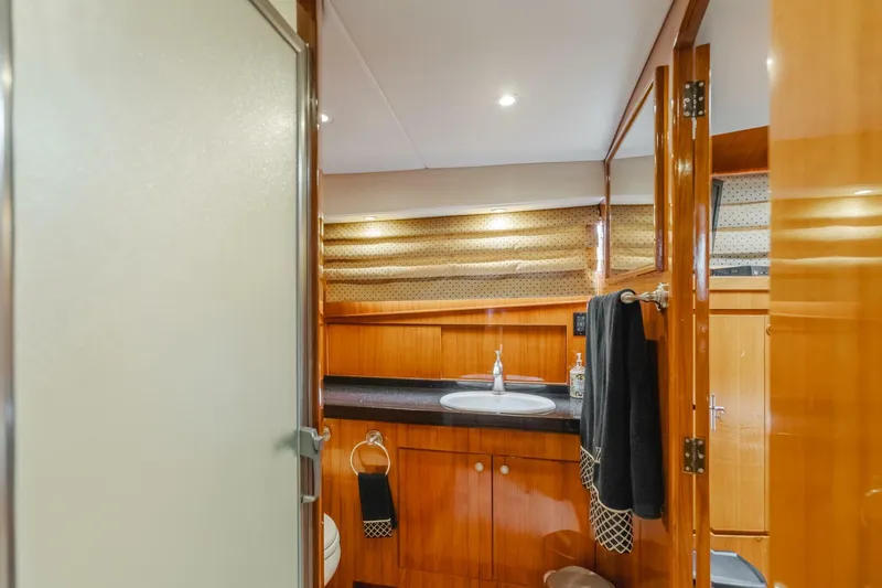 Fan Tail I Yacht Photos Pics Luxurious bathroom interior of 1988 Cheoy Lee 70 Enclosed Flybridge yacht.