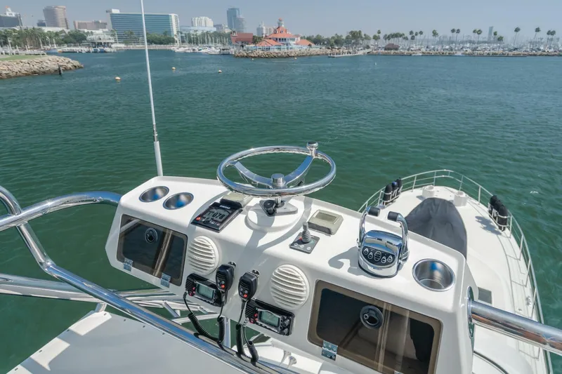 Fan Tail I Yacht Photos Pics 1988 Cheoy Lee 70 Enclosed Flybridge yacht helm with ocean view.