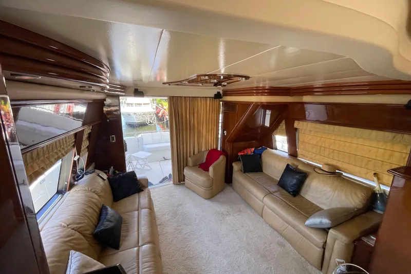  Yacht Photos Pics Luxurious interior of a 2006 Marquis 59 yacht with plush seating and elegant decor.