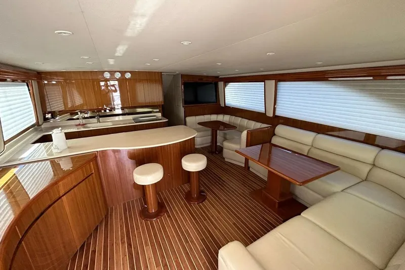  Yacht Photos Pics Luxurious interior of 2008 Viking Boats 60 Convertible yacht with elegant wood finishes.