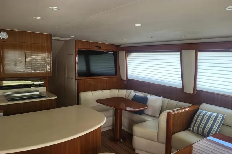  Yacht Photos Pics Luxurious interior of 2008 Viking Boats 60 Convertible with plush seating and modern amenities.