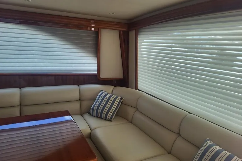  Yacht Photos Pics Luxurious interior of 2008 Viking Boats 60 Convertible with plush seating and striped pillow.