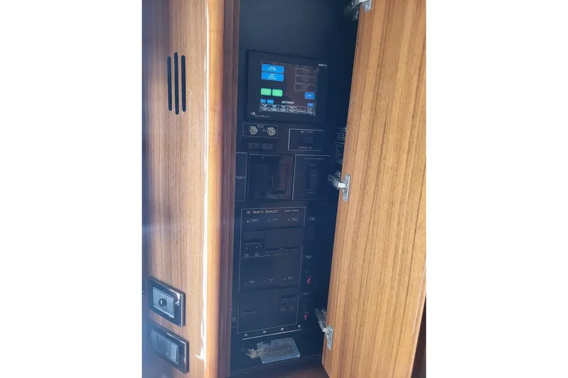 Yacht Photos Pics Electrical panel inside 2008 Viking Boats 60 Convertible, featuring control switches and display screen.