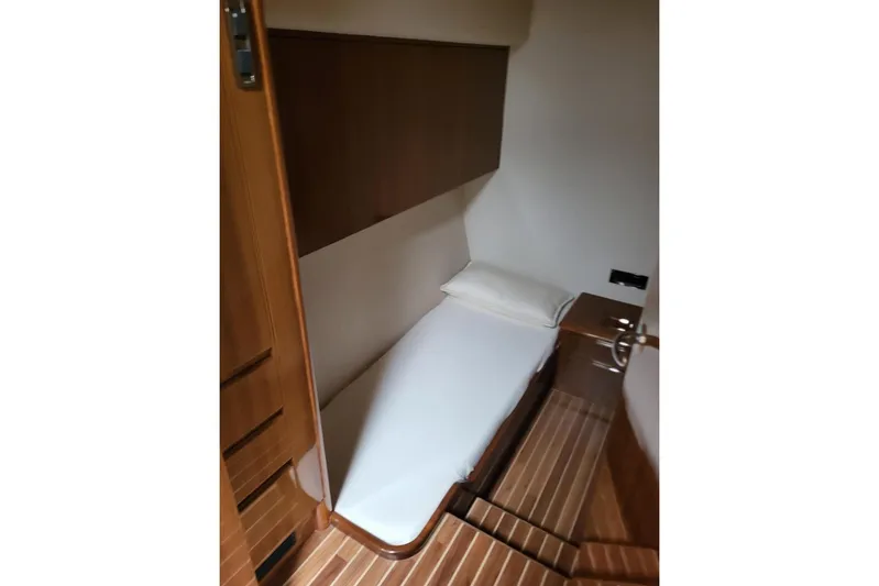  Yacht Photos Pics 2008 Viking Boats 60 Convertible cabin with single bed and wooden interior.