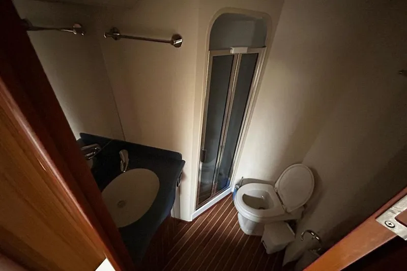  Yacht Photos Pics Bathroom interior of 2008 Viking Boats 60 Convertible with shower, sink, and toilet.