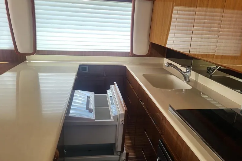  Yacht Photos Pics Luxurious kitchen interior of 2008 Viking Boats 60 Convertible yacht.