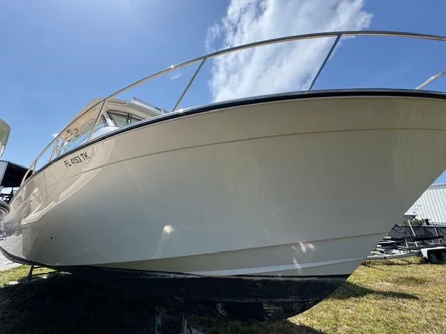  Yacht Photos Pics 2022 Grady-White Express 370 boat on grass under clear blue sky.