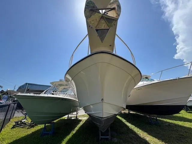  Yacht Photos Pics 2022 Grady-White Express 370 boat displayed outdoors under clear blue sky.