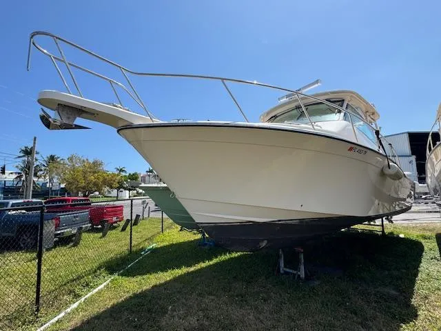  Yacht Photos Pics 2022 Grady-White Express 370 boat on display outdoors, sunny day.