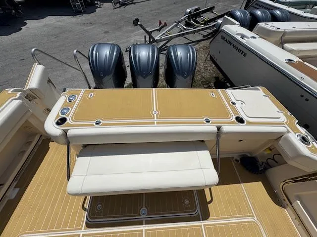  Yacht Photos Pics 2022 Grady-White Express 370 boat with triple outboard engines and spacious deck area.